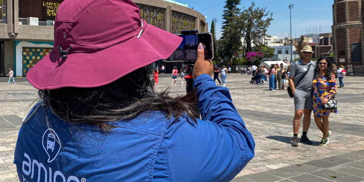Visitor photographing a historic church during the city stop