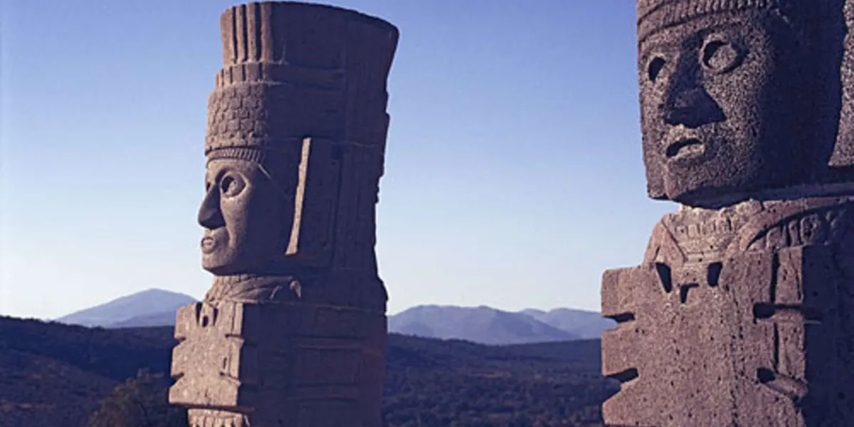 Close view of the faces and headdresses of Tula warrior figures