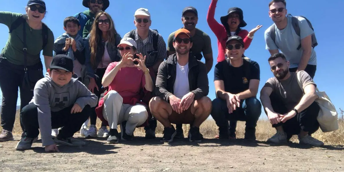 Group of visitors posing together at Teotihuacan