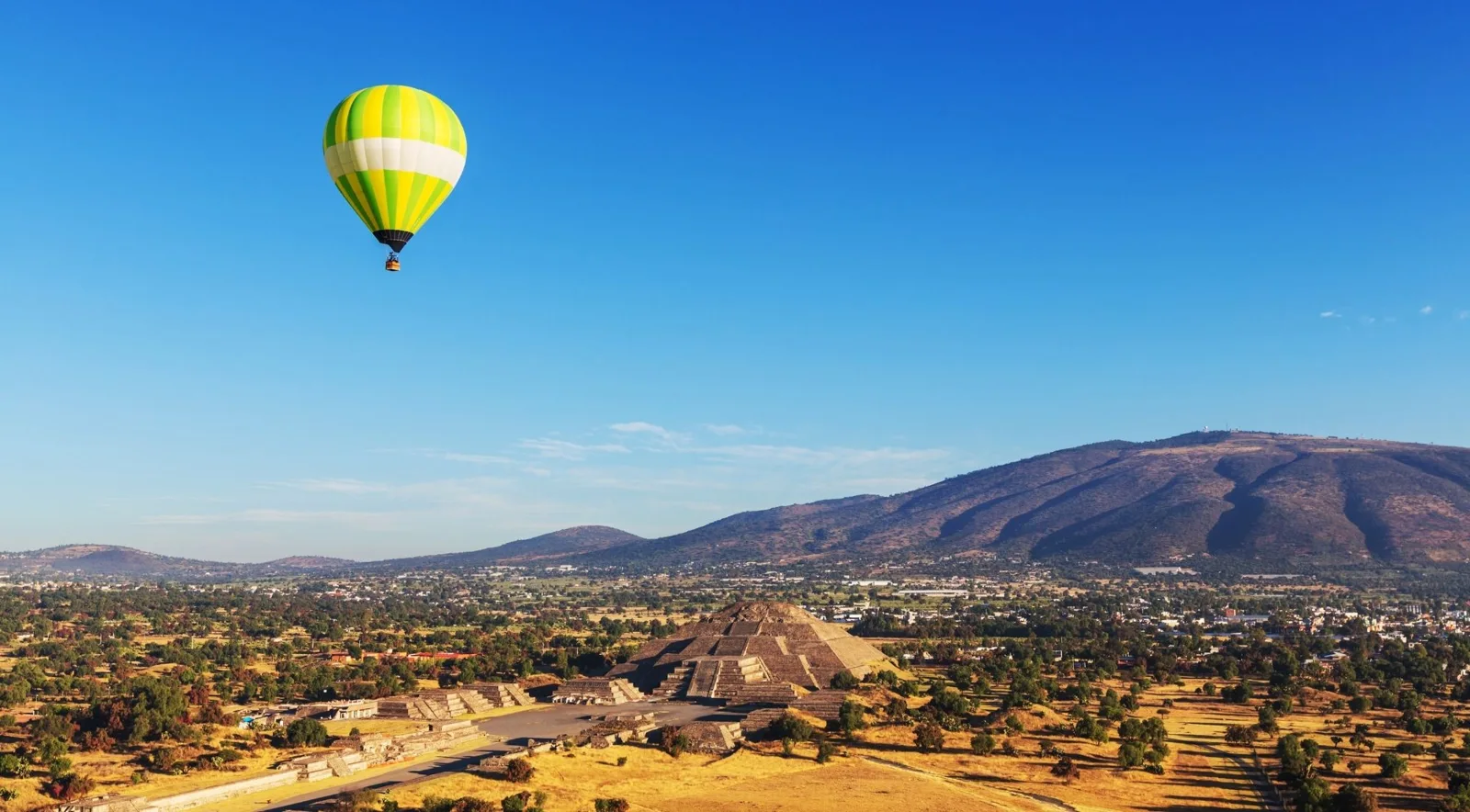 Yellow balloon above the Teotihuacán archaeological landscape