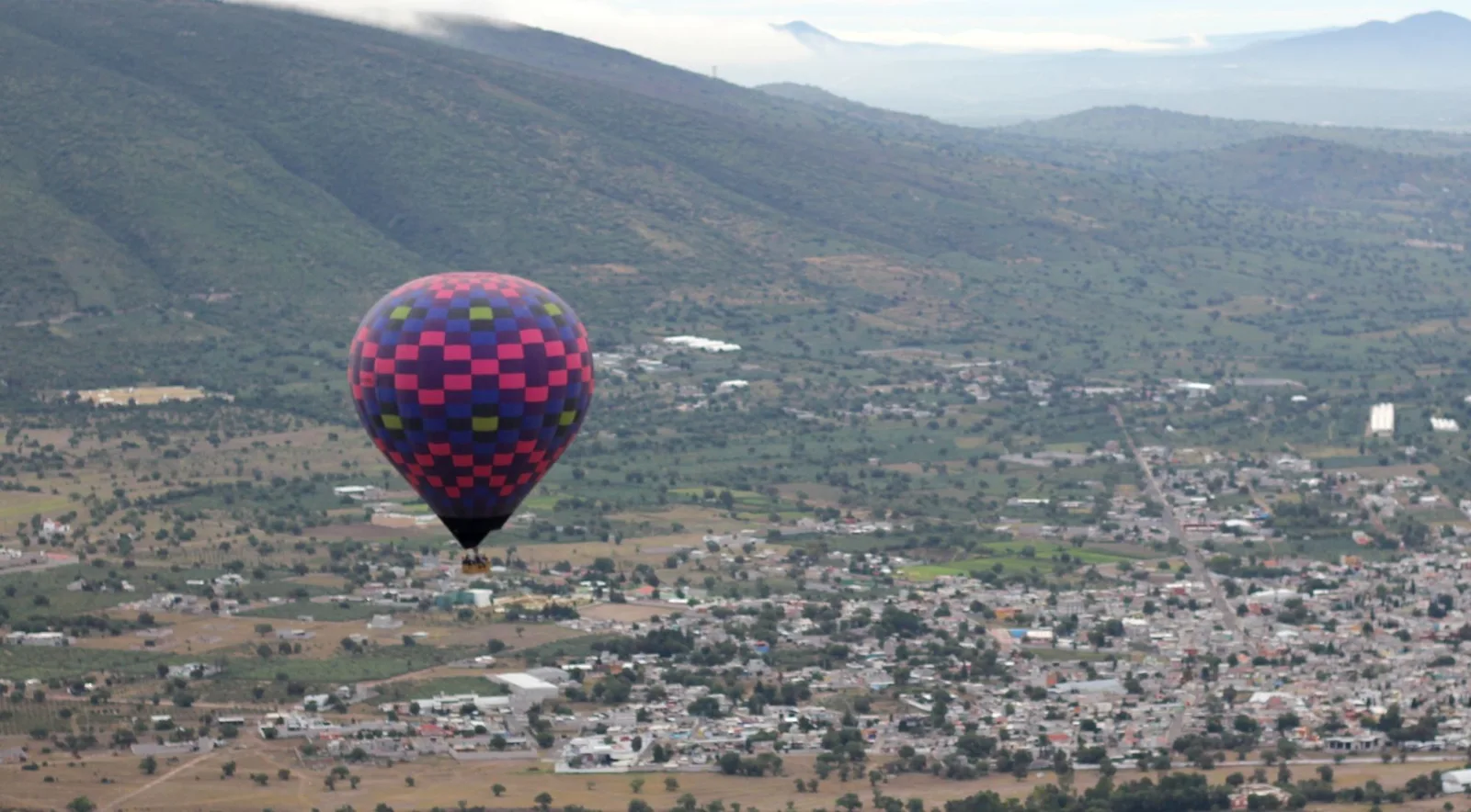 Balloon with the valley and mountains beyond